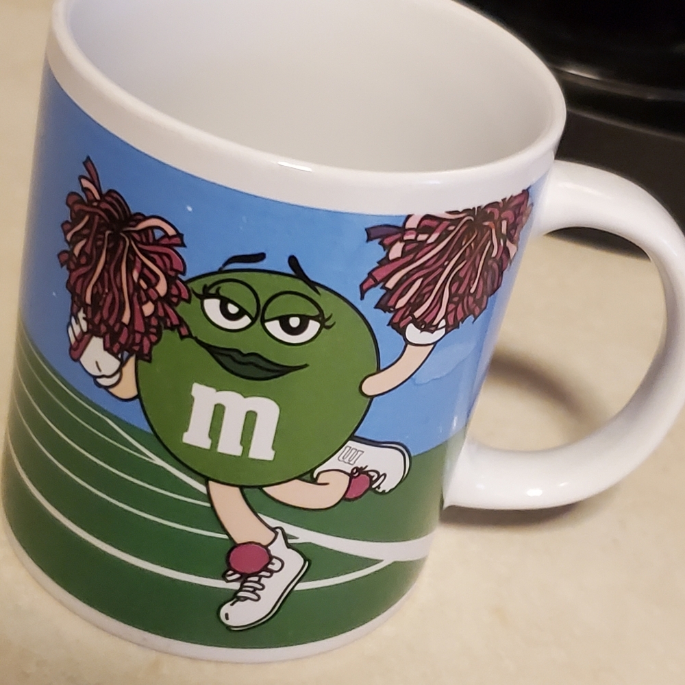 M&M coffee mug by Galerie cheerleader football